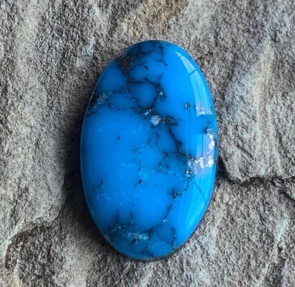 Ithaca Peak High Grade Oval Turquoise Cabochon With Silver Pyrite IP137