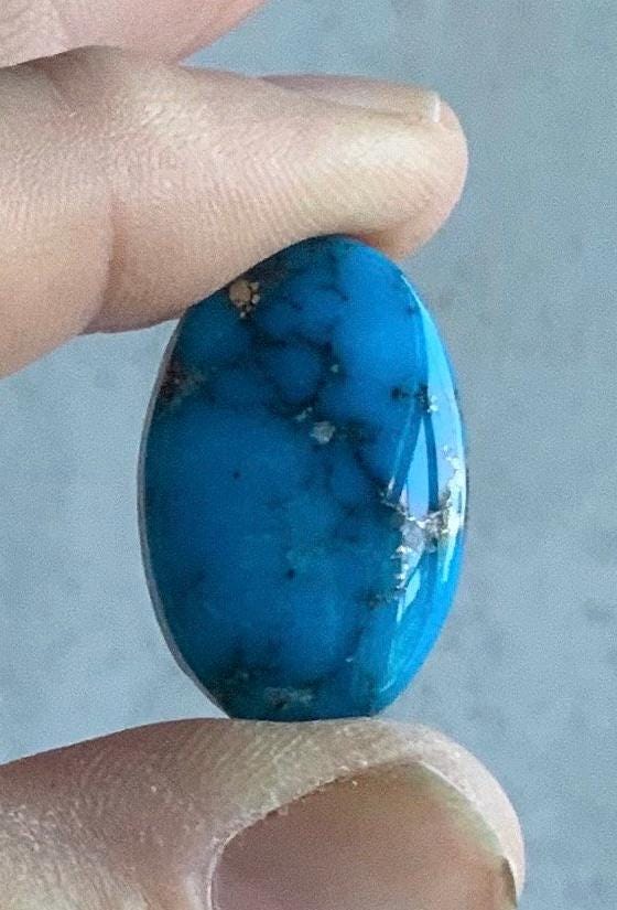 Ithaca Peak High Grade Oval Turquoise Cabochon With Silver Pyrite IP137