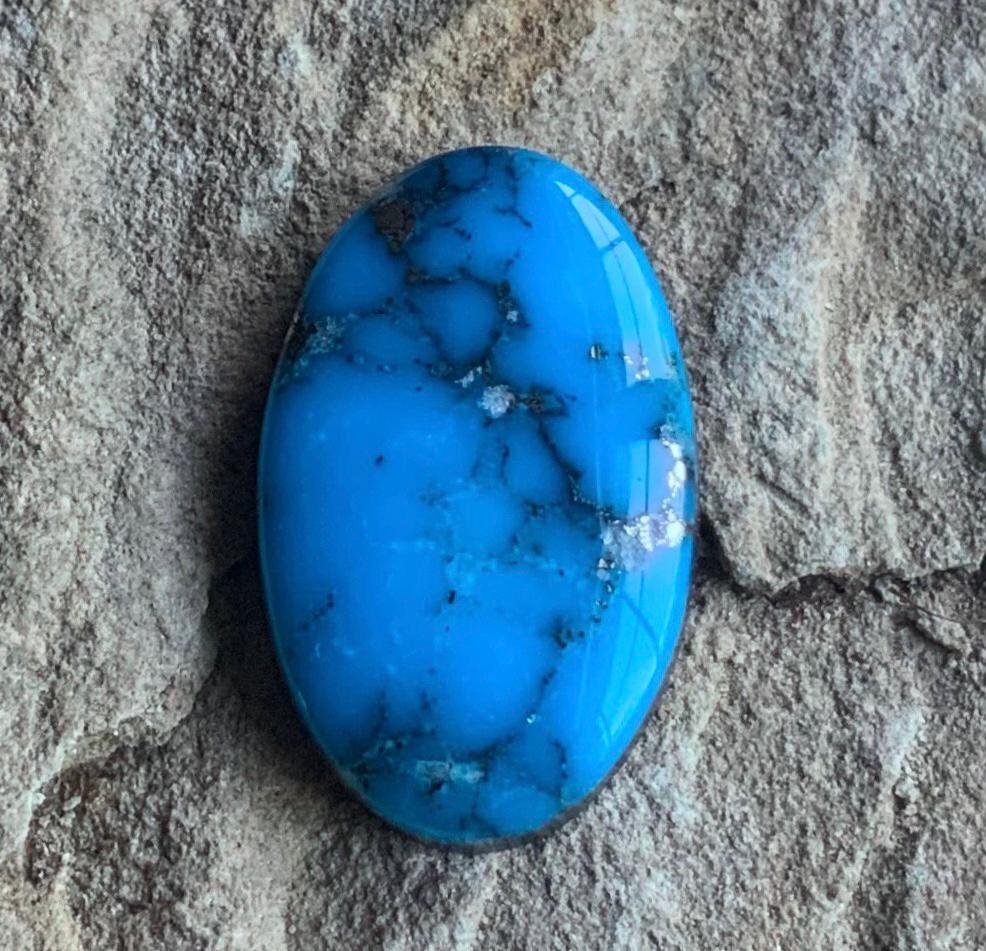 Ithaca Peak High Grade Oval Turquoise Cabochon With Silver Pyrite IP137