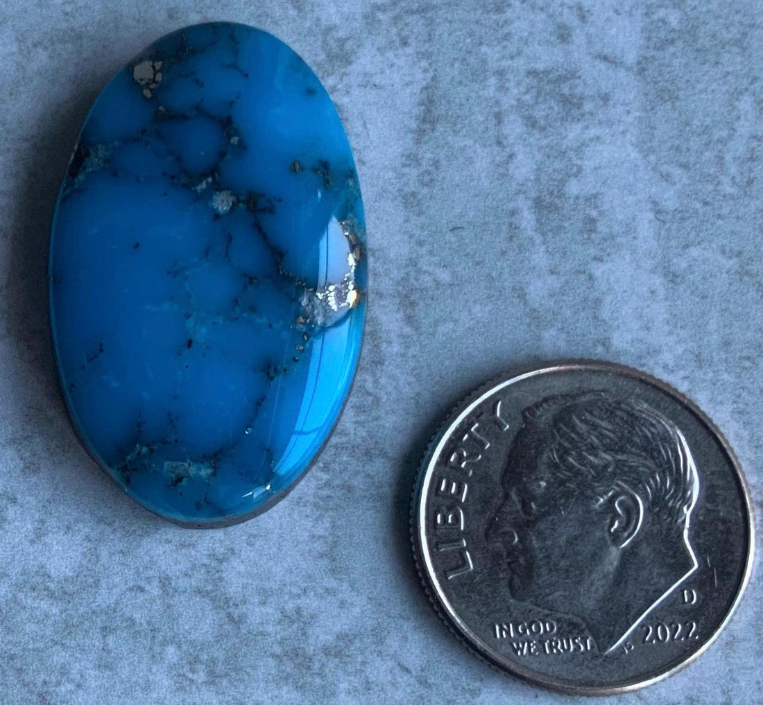Ithaca Peak High Grade Oval Turquoise Cabochon With Silver Pyrite IP137