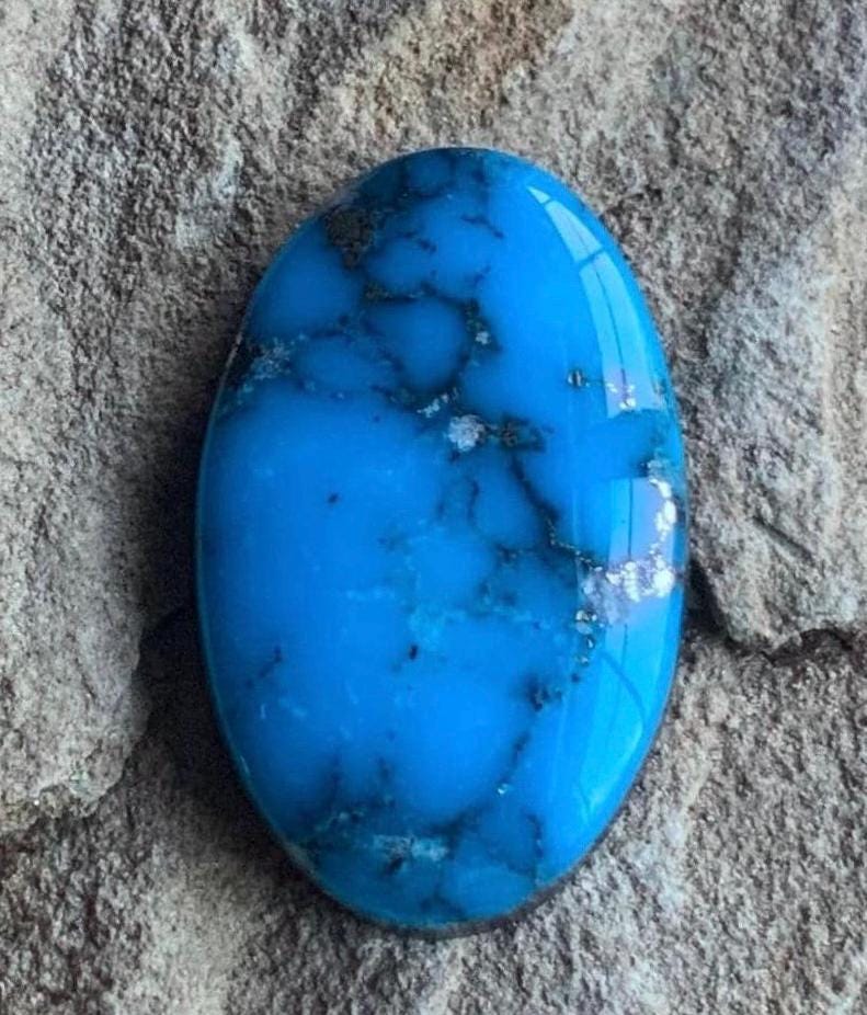 Ithaca Peak High Grade Oval Turquoise Cabochon With Silver Pyrite IP137