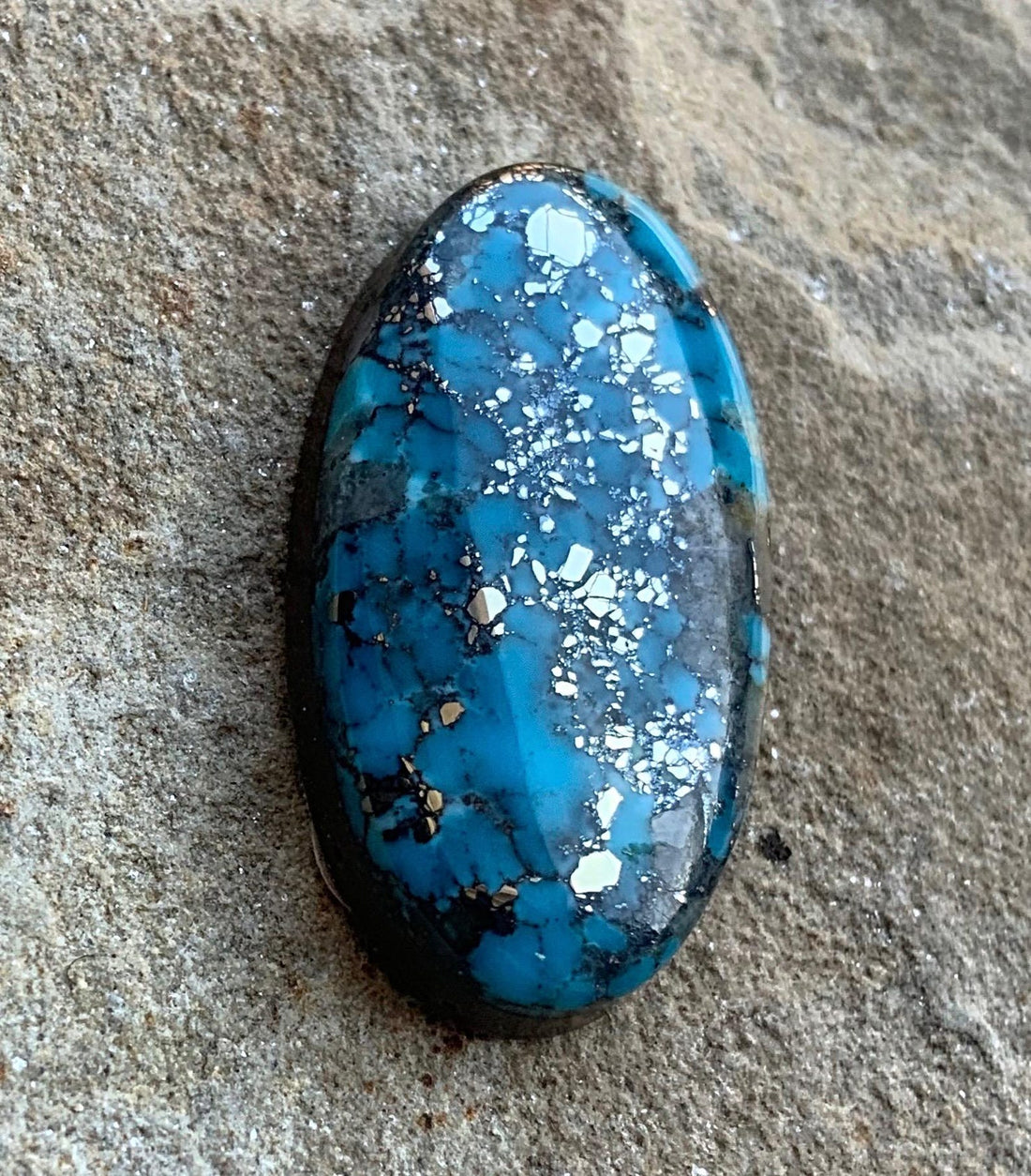 Ithaca Peak High Grade Turquoise Oval Cabochon With Silver Pyrite & Quartz Inclusions