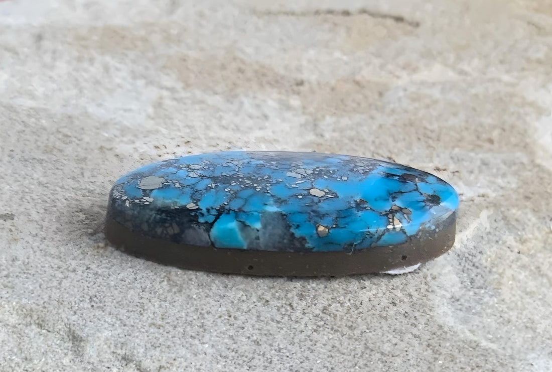 Ithaca Peak High Grade Turquoise Oval Cabochon With Silver Pyrite & Quartz Inclusions